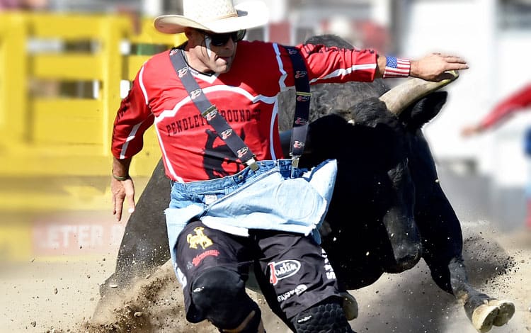 Man being chased by bull